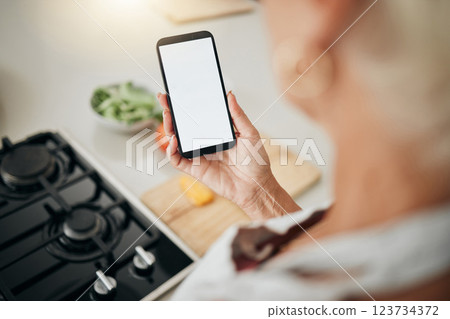 Recipe, cooking and healthy food list on a phone screen with a woman to cook in a kitchen home. Nutritionist person ready to start health, nutrition and vegetables for a meal using mobile technology 123734372