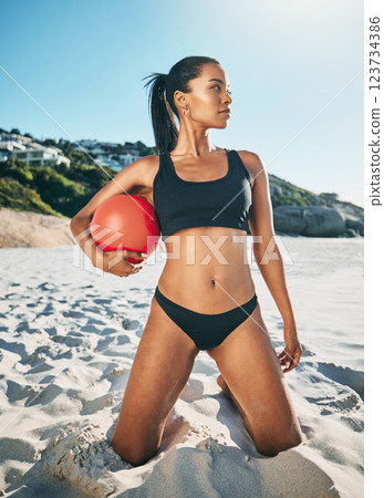 Fitness, beach and travel with woman and volleyball on Brazil holiday training in a bikini for sports, summer and workout. Exercise, wellness and health with girl athlete in the sand for vacation 123734386