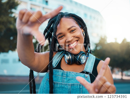 Hands frame, city portrait and black woman with headphones for music during travel holiday in Italy. Happy, and young African girl with perspective, inspiration and vision on fun vacation in summer Hands frame, city portrait and black woman with headphones for music during travel holiday in Italy. Happy, and young African girl with perspective, inspiration and vision on fun vacation in summer 123734391