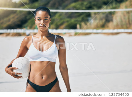 Fitness, beach and volleyball by woman player holding a ball, ready for competitive sports match. Travel, sport and workout by female ready for a challenge, cool attitude and mindset while exercising 123734400