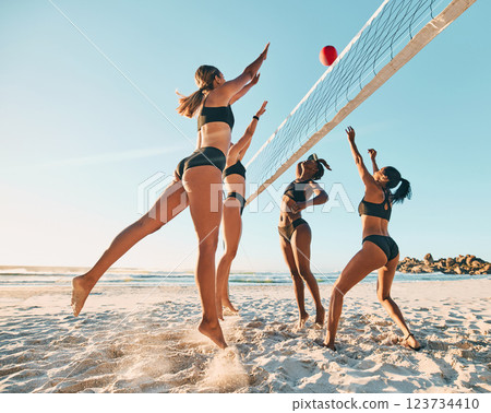 Beach volleyball, friends and women playing in the sand and summer sun. Fitness, diversity and sports on holiday in Brazil, woman team jumping for ball. Volley ball, bikini and a ball game at the sea 123734410