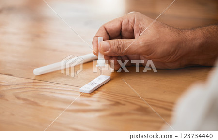 Hands, covid antigen test or dropper in home kit, house or living room for healthcare insurance or medical virus disease. Zoom, man or pcr covid 19 check for patient in isolation lockdown compliance 123734440