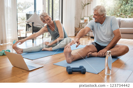 Stretching, fitness and senior couple with workout on the internet together on the living room floor. Happy, calm and healthy elderly man and woman training for wellness with exercise video on web 123734442