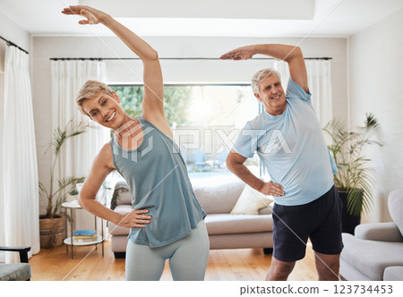 Stretching, yoga and fitness with a senior couple doing an exercise, workout or training at home. Health and wellness, lifestyle and active with a fit elderly man and woman exercising in a house Stretching, yoga and fitness with a senior couple doing an exercise, workout or training at home. Health and wellness, lifestyle and active with a fit elderly man and woman exercising in a house 123734453