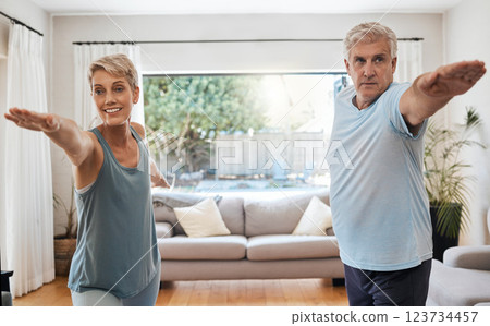 Yoga, workout and senior couple doing exercise in their home to keep active. Old woman and man doing fitness training in their living room. Healthy lifestyle, wellness and stretching after retirement Yoga, workout and senior couple doing exercise in their home to keep active. Old woman and man doing fitness training in their living room. Healthy lifestyle, wellness and stretching after retirement 123734457