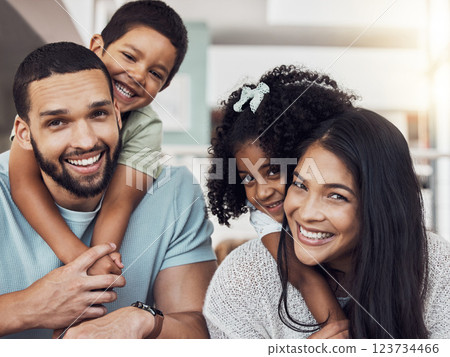 Parents, kids and happy family home portrait in living room, lounge and relaxing quality time, play and fun together in Spain. Smile mom, dad and bonding with young children in love, support and care 123734466