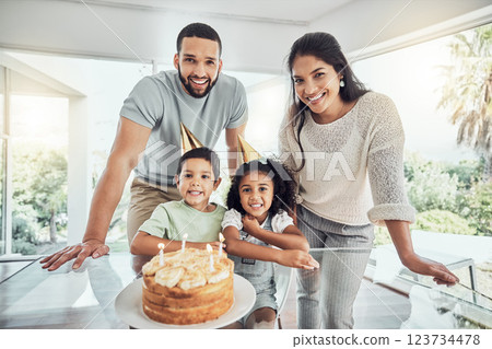 Happy, smile and portrait of a family at birthday celebration with cake, candles and fun hats at home. Happiness, excited and children celebrating with their parents at a party in their modern house. 123734478