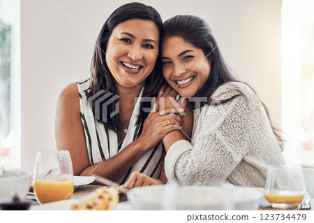 Family, love and mother with her adult daughter at home, eating food and enjoying time together. Love, bonding and lunch with a mature female sitting at a dinner table in their house 123734479