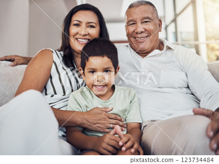 Family, child and grandparents or foster parents with adopted child sitting on the sofa at home with smile and love. Portrait of boy kid with man and woman parents bonding in their puerto rico house Family, child and grandparents or foster parents with adopted child sitting on the sofa at home with smile and love. Portrait of boy kid with man and woman parents bonding in their puerto rico house 123734484