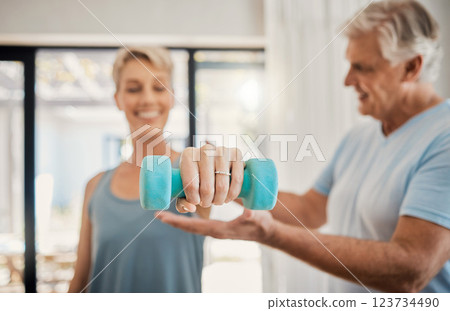 Elderly, couple and training in home for health, motivation and fitness. Retirement, woman and man teaching in weightlifting workout in living room for wellness, exercise and healthy lifestyle 123734490
