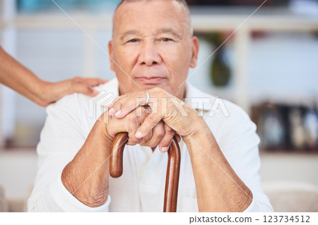 Portrait of elderly man with walking stick, serious and sitting thinking, memories at retirement home. Grandpa with wooden cane, senior care for disability and nostalgia, a lonely expression on face. 123734512