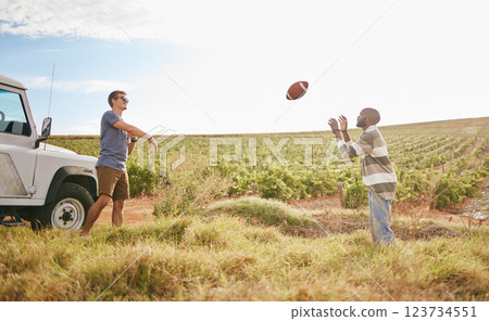 Friends on a trip, travel and play football in nature on field in countryside. Fun, care free men playing together and relaxation on holiday break for bonding in serene landscape in summer. Friends on a trip, travel and play football in nature on field in countryside. Fun, care free men playing together and relaxation on holiday break for bonding in serene landscape in summer. 123734551