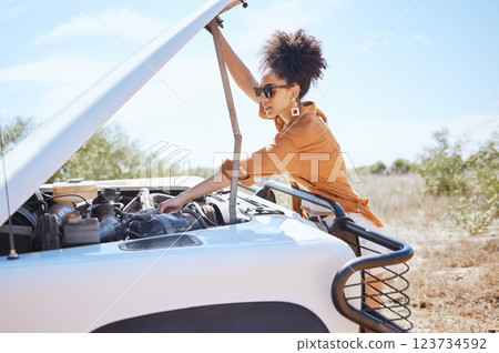 Black woman car engine problem on road trip or outdoor holiday travel journey in Africa. Girl driver stop traveling, vacation and accident emergency assistance try fix or repair motor transportation 123734592