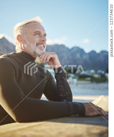 Surf, happy and surfboard mature man at beach for fitness and adventure on summer tropical Hawaii vacation. Sport person, retirement and healthy lifestyle motivation, surfing and water sport in sun. 123734610