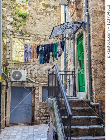 Kotor's Colour: Laundry on a Balcony Among Cobblestone Streets. Kotor's Colour: Laundry on a Balcony Among Cobblestone Streets. 123734612