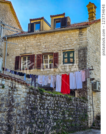 Kotor's Colour: Laundry on a Balcony Among Cobblestone Streets. Kotor's Colour: Laundry on a Balcony Among Cobblestone Streets. 123734648