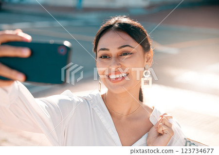 Phone, selfie and shopping with a woman customer taking a photograph while in the city for retail or consumerism. Mobile, technology and consumer with a young female outdoor to shop, buy or purchase 123734677