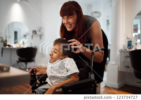Woman, salon and smile with disability child in wheelchair for haircut. Happy, boy and girl hairdresser for cleaning, cut and styling cerebral palsy kid hair at professional barber store in New York Woman, salon and smile with disability child in wheelchair for haircut. Happy, boy and girl hairdresser for cleaning, cut and styling cerebral palsy kid hair at professional barber store in New York 123734727