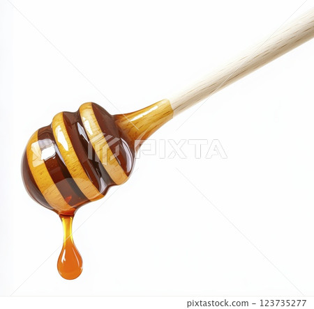 Wooden honey dipper with dripping golden honey, isolated on white background with clipping path 123735277