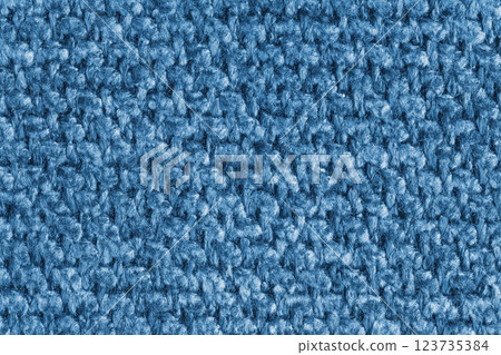 Texture of blue jacquard fabric of rough weave structure close up, macro, background Texture of blue jacquard fabric of rough weave structure close up, macro, background 123735384