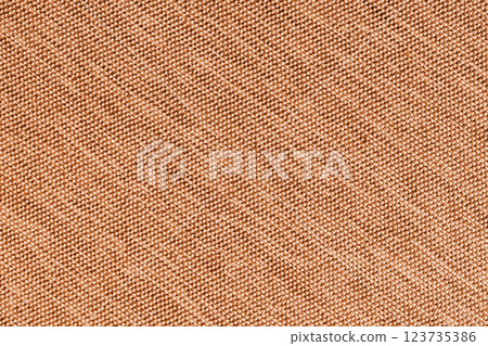 Closeup, macro of orange fabric texture background. Satin diagonal weaving cloth structure, canvas Closeup, macro of orange fabric texture background. Satin diagonal weaving cloth structure, canvas 123735386