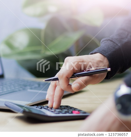 Accounting in business, Businessman keeps accounting records using a calculator 123736057