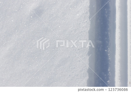 Straight lines remaining in the white snow 123736086