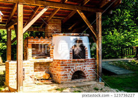 outdoor kitchen with pizza oven and barbeque grill. outdoor kitchen with pizza oven and barbeque grill. 123736227