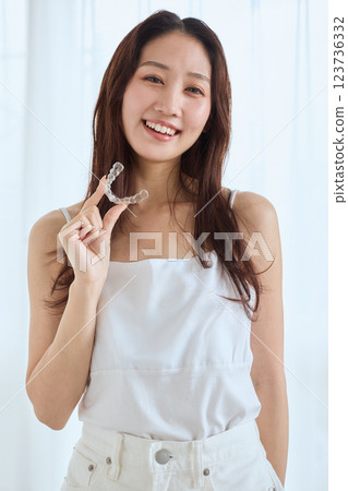 Woman with mouthpiece orthodontics Woman with mouthpiece orthodontics 123736332