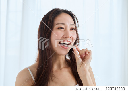 A woman wearing a mouthpiece 123736333