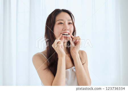 A woman wearing a mouthpiece 123736334