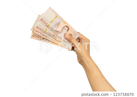 Asian woman holding Thai baht banknote money in hand isolated on white background. 123738870