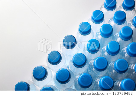 Many plastic bottles of mineral water lined up 123739492
