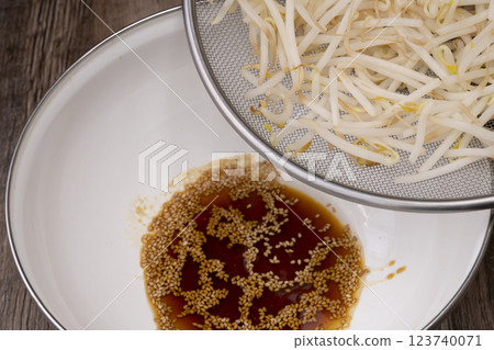 Steps for making bean sprout and cucumber namul Steps for making bean sprout and cucumber namul 123740071