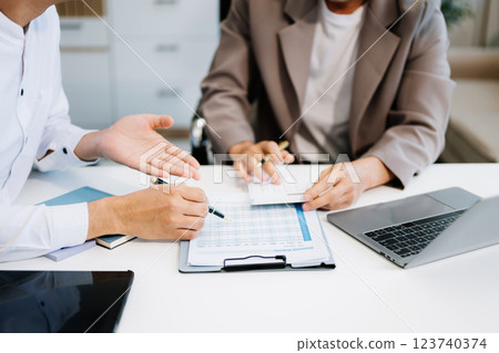 business people and lawyers discussing contract papers sitting at the table. Concepts of law, advice, legal services business people and lawyers discussing contract papers sitting at the table. Concepts of law, advice, legal services 123740374