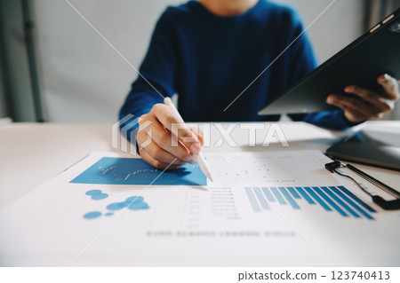 Businesswoman utilizing smartphone and tablet technology. Perfect for corporate, technology, 123740413