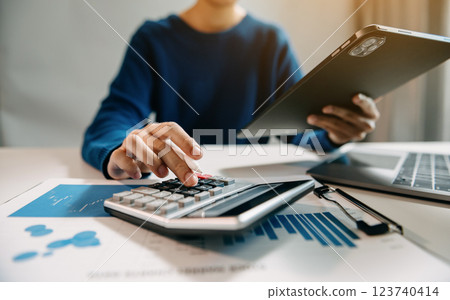 Businesswoman utilizing smartphone and tablet technology. Perfect for corporate, technology, 123740414