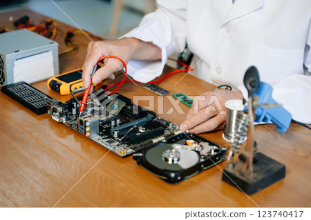 The technician repairing the motherboard in the lab with copy space. the concept of computer hardware, 123740417