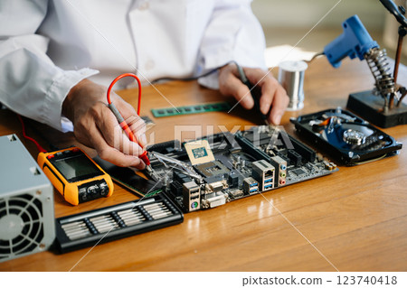 The technician repairing the motherboard in the lab with copy space. the concept of computer hardware, 123740418