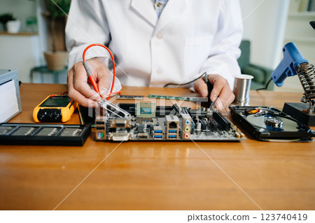 The technician repairing the motherboard in the lab with copy space. the concept of computer hardware, 123740419