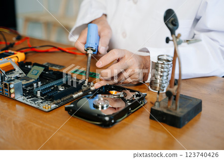 The technician repairing the motherboard in the lab with copy space. the concept of computer hardware, 123740426