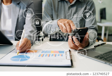 Zero trust security concept Person using computer and tablet with zero trust icon on virtual screen 123740527