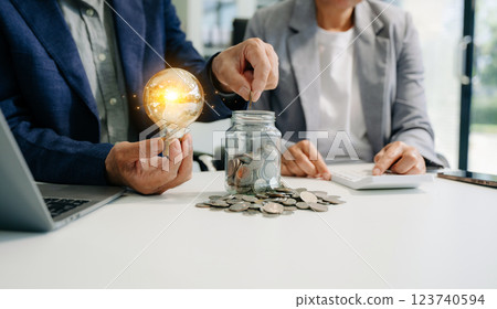 business team hand showing creative business strategy with light bulb 123740594