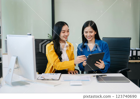 Businesswomen work and discuss their business plans. A woman employee explains Businesswomen work and discuss their business plans. A woman employee explains 123740690
