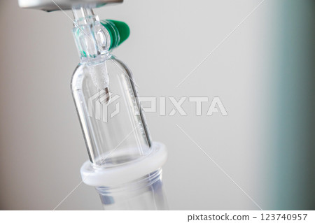 Close up medical intravenous IV drip in hospital background 123740957