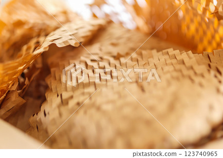 Eco friendly brown paper honeycomb wrap for product packaging parcel carton box Eco friendly brown paper honeycomb wrap for product packaging parcel carton box 123740965