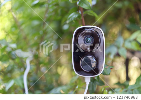 Security IP CCTV camera using solar energy install on the tree for home security system 123740968