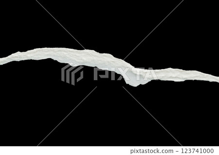 Ripped torn paper edges isolated on black background 123741000