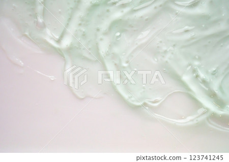 Transparent clear green liquid serum gel cosmetic texture background Transparent clear green liquid serum gel cosmetic texture background 123741245