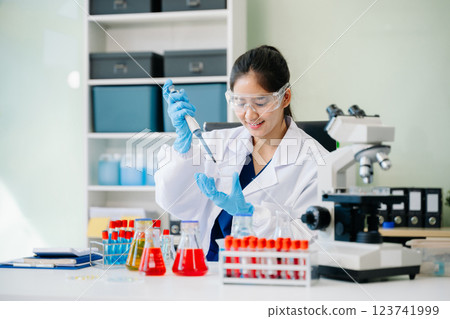 Scientists, beakers, and microscopes in cutting-edge research. Perfect for science and technology projects. 123741999